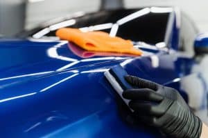 Ceramic Coatings. Car Service Worker Applying Nano Coating On A Car.
