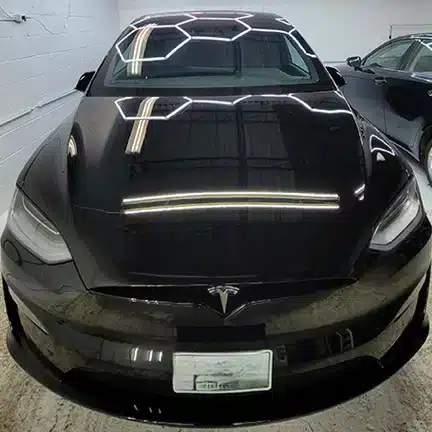 Tesla after professional ceramic coating and paint preparation at MNV Auto Detailing in Toronto