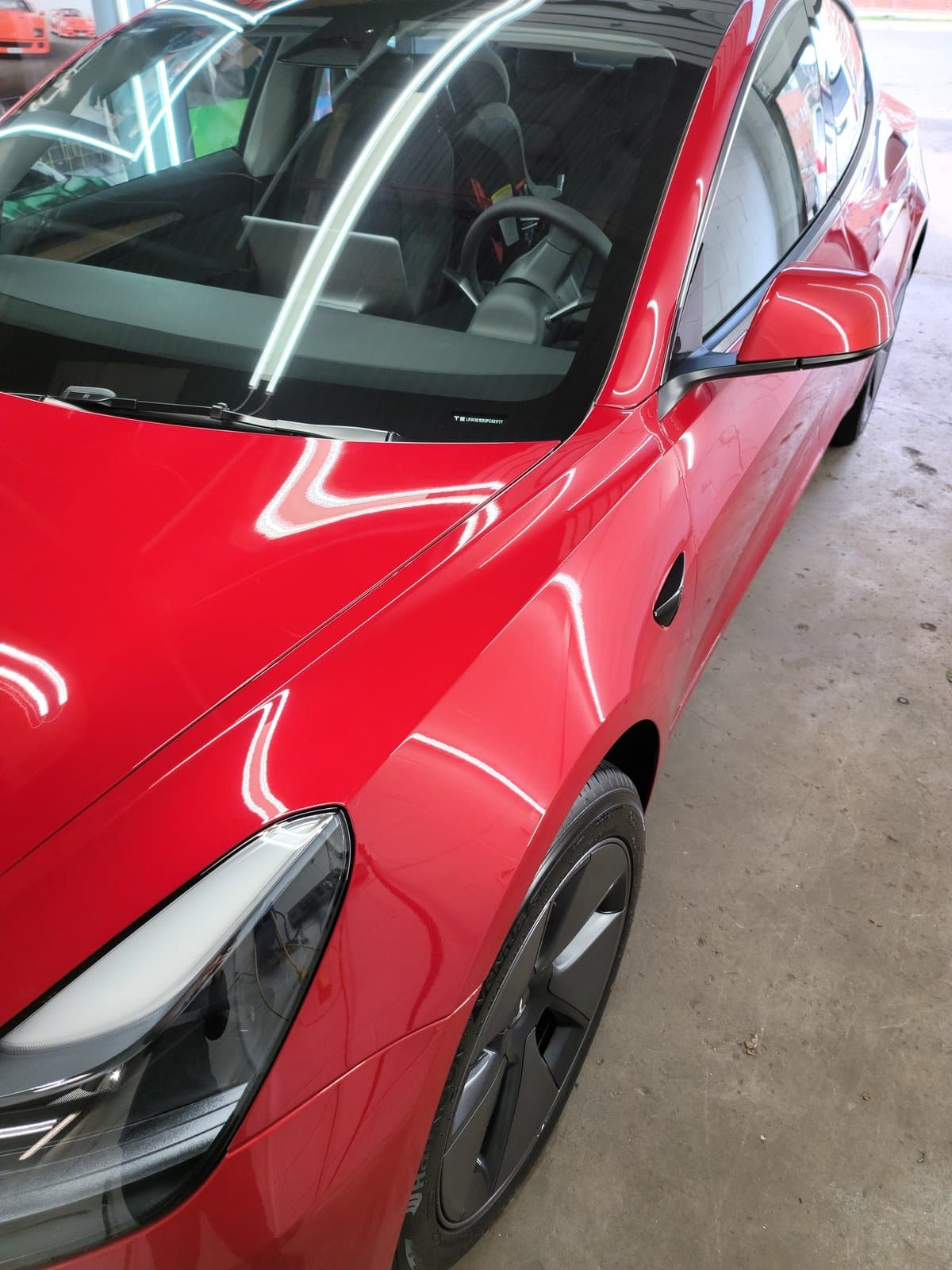 Tesla front end undergoing professional paint protection preparation at MNV Auto Detailing in Toronto