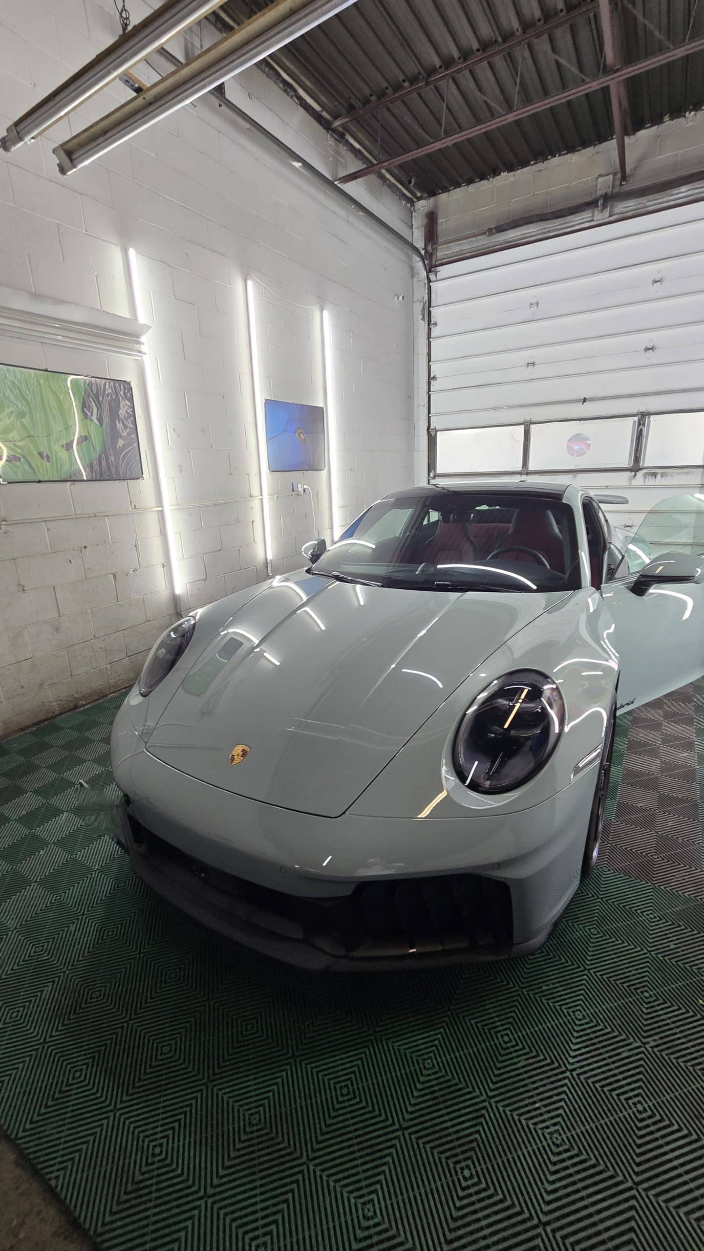 Light grey Porsche 911 showing a reflective finish after ceramic coating by MNV Auto Detailing