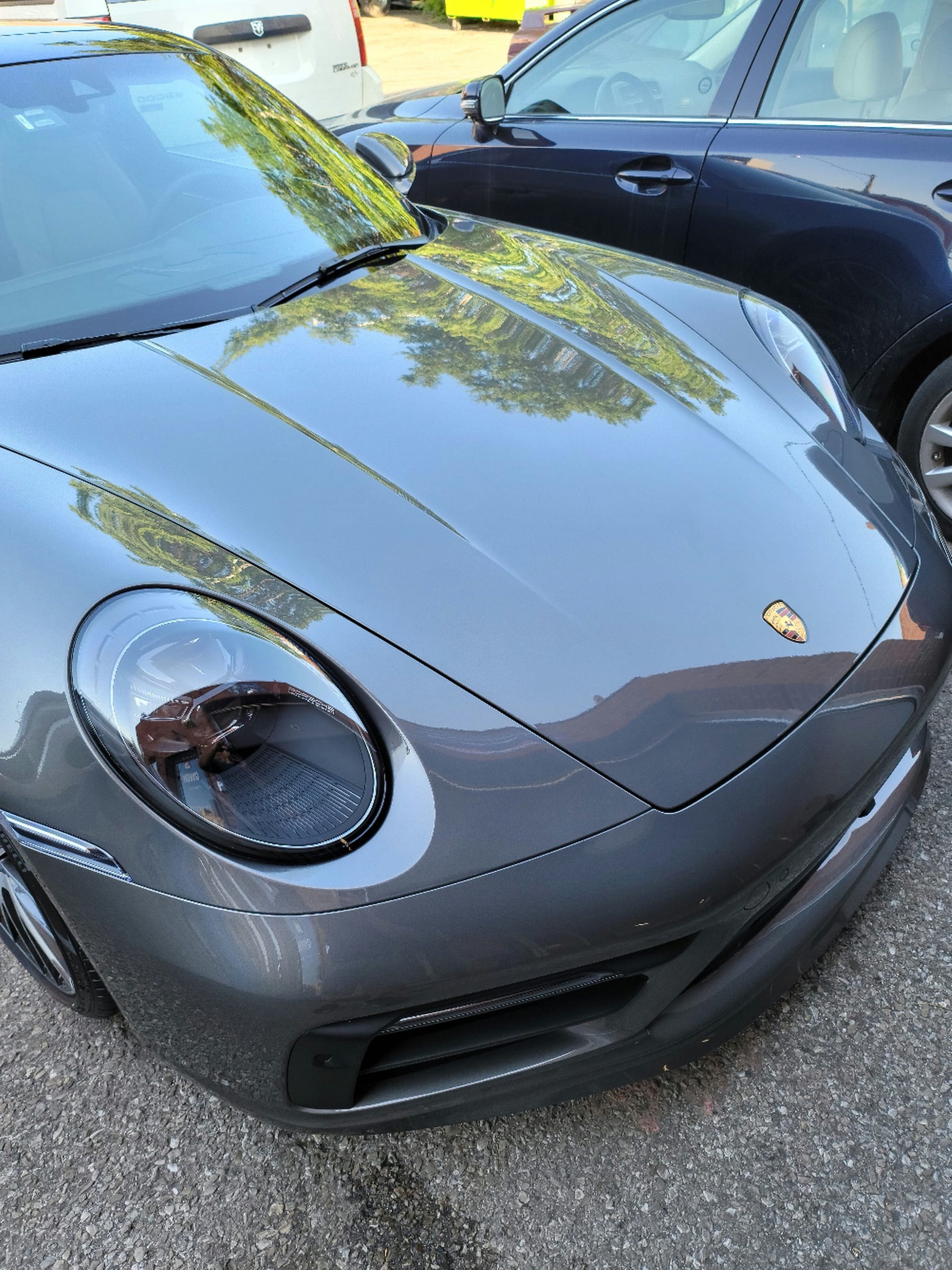 Close-up of grey Porsche 911 paint finish after ceramic coating by MNV Auto Detailing
