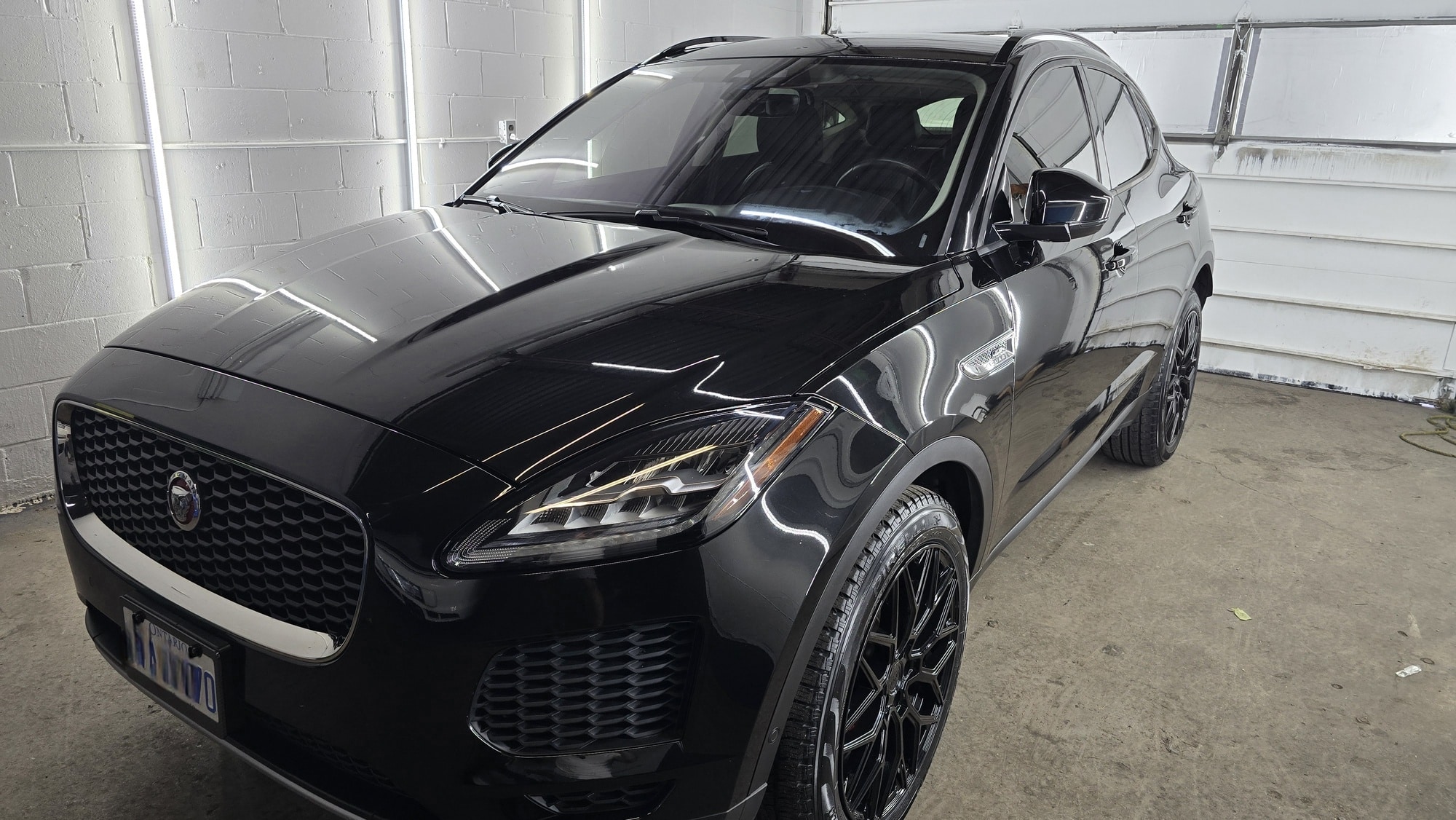 Black Jaguar SUV showing a deep glossy finish after ceramic coating by MNV Auto Detailing