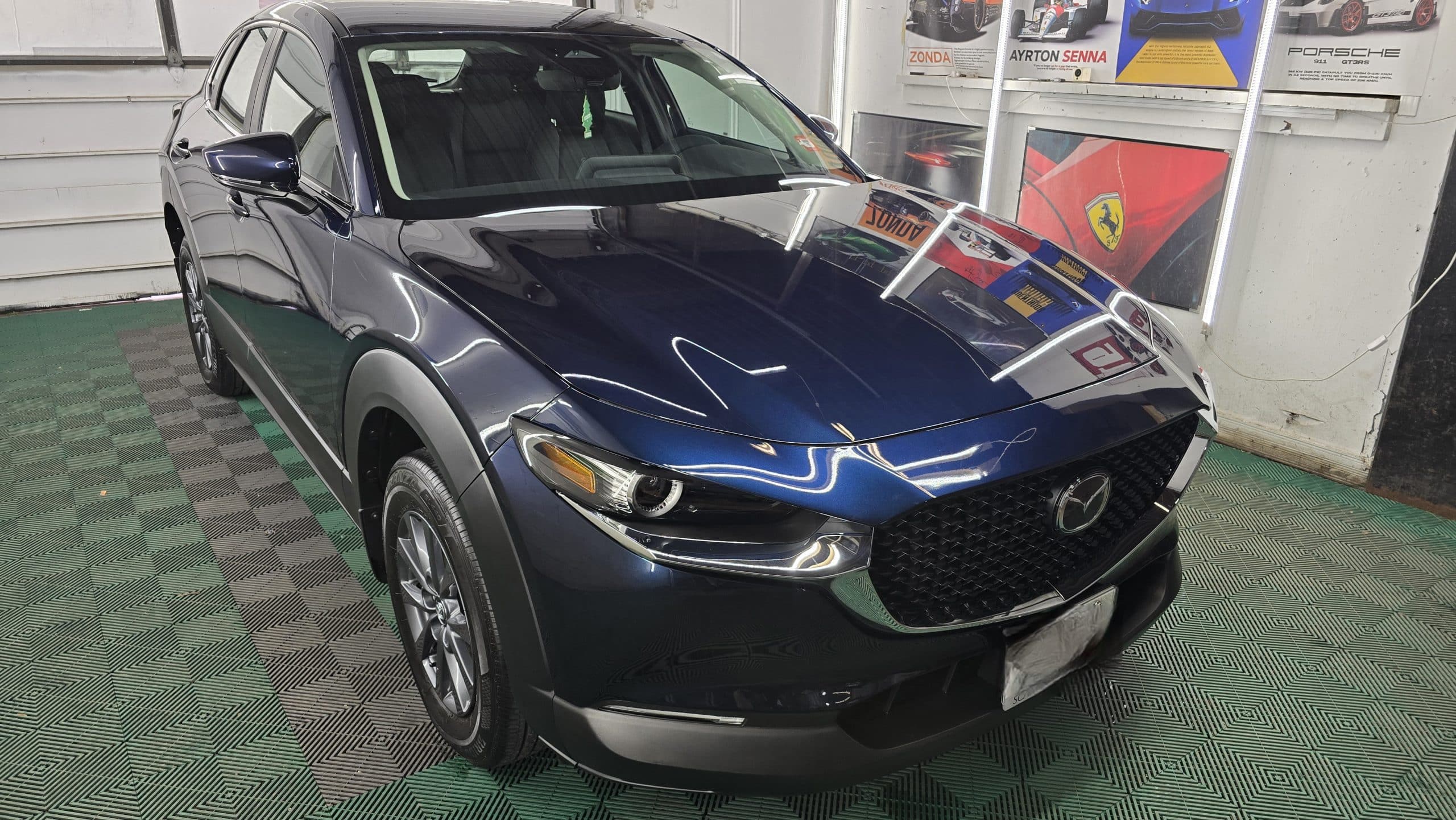 Dark blue Mazda SUV showing a glossy finish after ceramic coating by MNV Auto Detailing