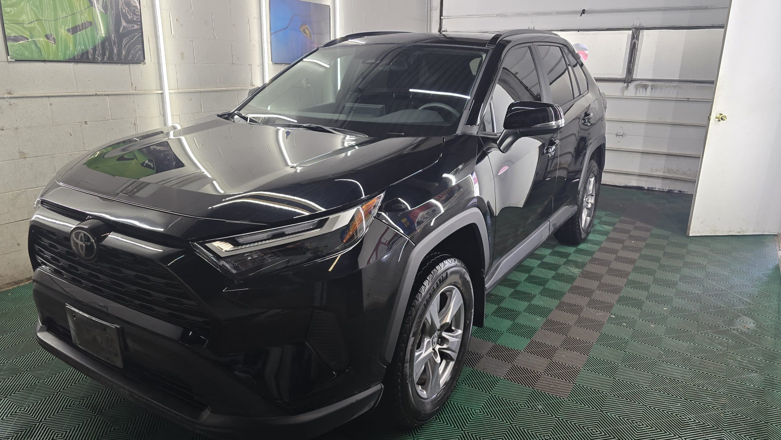 Black Toyota RAV4 after professional exterior protection