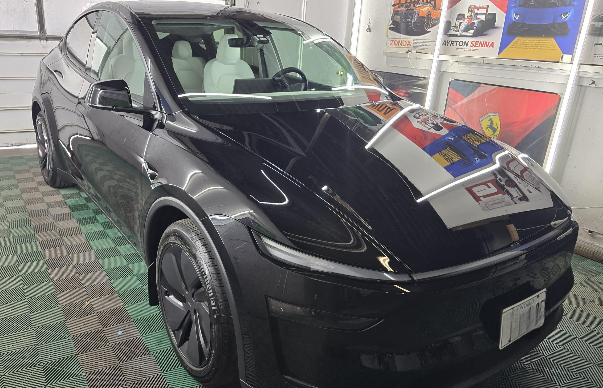 Tesla after professional ceramic coating at MNV Auto Detailing in Toronto showing deep gloss and a highly reflective finish