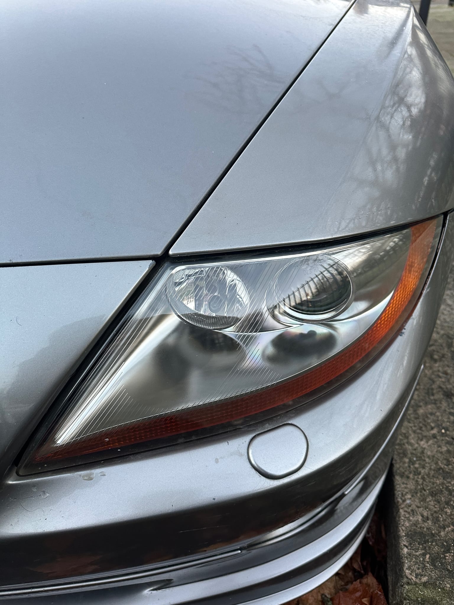 Clear restored vehicle headlight after polishing at MNV Auto Detailing